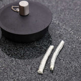 To small replacement wicks for SACKit Oil Lamp in a clear plastic bag on a white background.