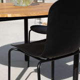 Taupe Patio Chair no. One S1 with black frame made of recycled plastic and powder-coated steel outdoors