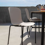 Taupe Patio Chair no. One S1 with black powder-coated steel frame on outdoor terrace setting