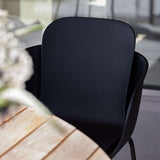 Taupe Patio Chair no. One S2 with black frame made of recycled plastic and powder-coated steel.