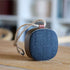 Go Wood trådløs højtaler i røget egetræ med Fiord tekstil fra KVADRAT, elegant og transportabel.