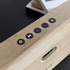 Move Wood Bluetooth højtaler i naturlig egetræ med Fiord tekstil fra Kvadrat og messingdetaljer.