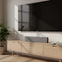 SACKit Wave Soundbar i slankt design med tekstilfront og flere tilslutningsmuligheder, vist i et moderne hjemmemiljø.
