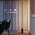 Sort SACKit Expo 185 gulvlampe med slank aluminiumsprofil og marmorfod med opadrettet LED-lys.