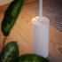 SACKit Expo 185 hvid gulvlampe med slank aluminiumsprofil og marmorfod, opadrettet LED-lys.