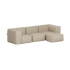Beige blød udendørs sofa med modulopbygning og separat puf, designet til komfortabel afslapning under åben himmel i nordisk udeliv
