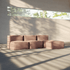 Blød indendørs sofa med pouf i varmt beige stof fra sackit i et lyst rum med store vinduer og bløde skygger fra sollyset