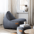 Canvas Lounge Chair og puf i petrolfarvet canvas stof med synlige hørsting og formstabilt design.