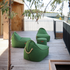 Cobana Lounge Chair og puf i gråt olefinstof med formstabilt design og håndsyede sting.