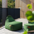 Cobana Lounge Chair og puf i gråt stof med rund puf og sækkestol med ryglæn.