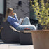 Cobana Lounge Chair og Pouf i gråt slidstærkt og vandafvisende stof med formstabilt design.