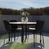 Taupe Patio Chair no. One S1 with black frame made of recycled plastic and powder-coated steel.