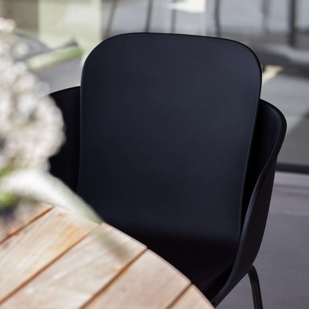 Taupe Patio Chair no. One S2 with black frame made of recycled plastic and powder-coated steel.