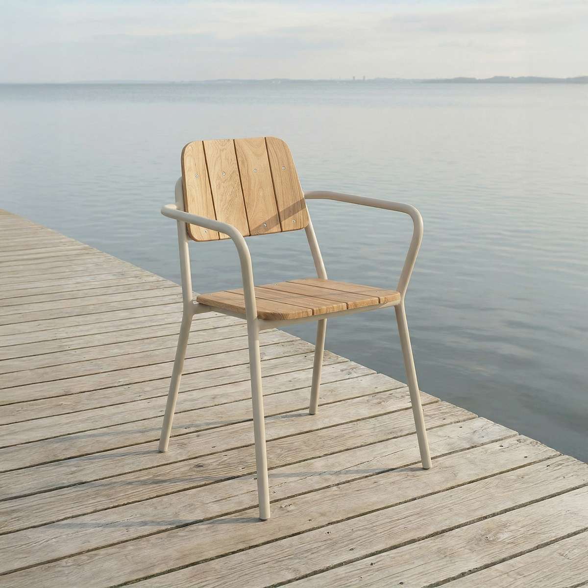 Taupe Kirra Patio Chair in powder-coated aluminum and untreated teak wood on a terrace setting